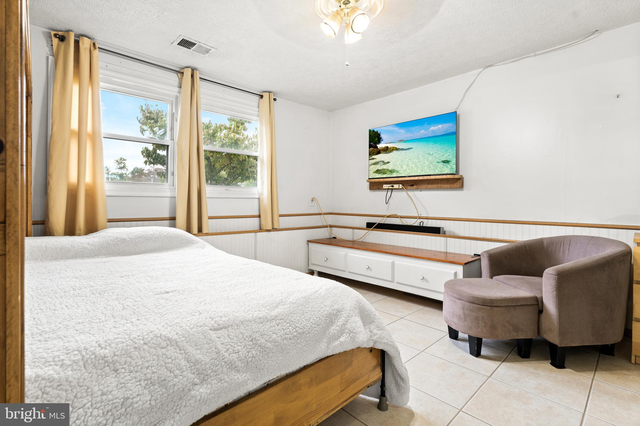 7907 Stone Hearth Road Severn, MD 21144 - Photo 20 of 24 a bedroom with furniture and a large window