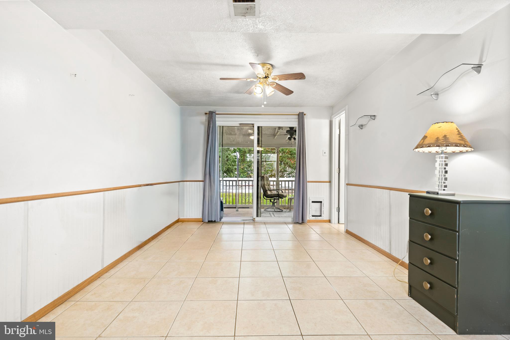 7907 Stone Hearth Road Severn, MD 21144 - Photo 21 of 24 a view of a room with cabinet and a ceiling fan