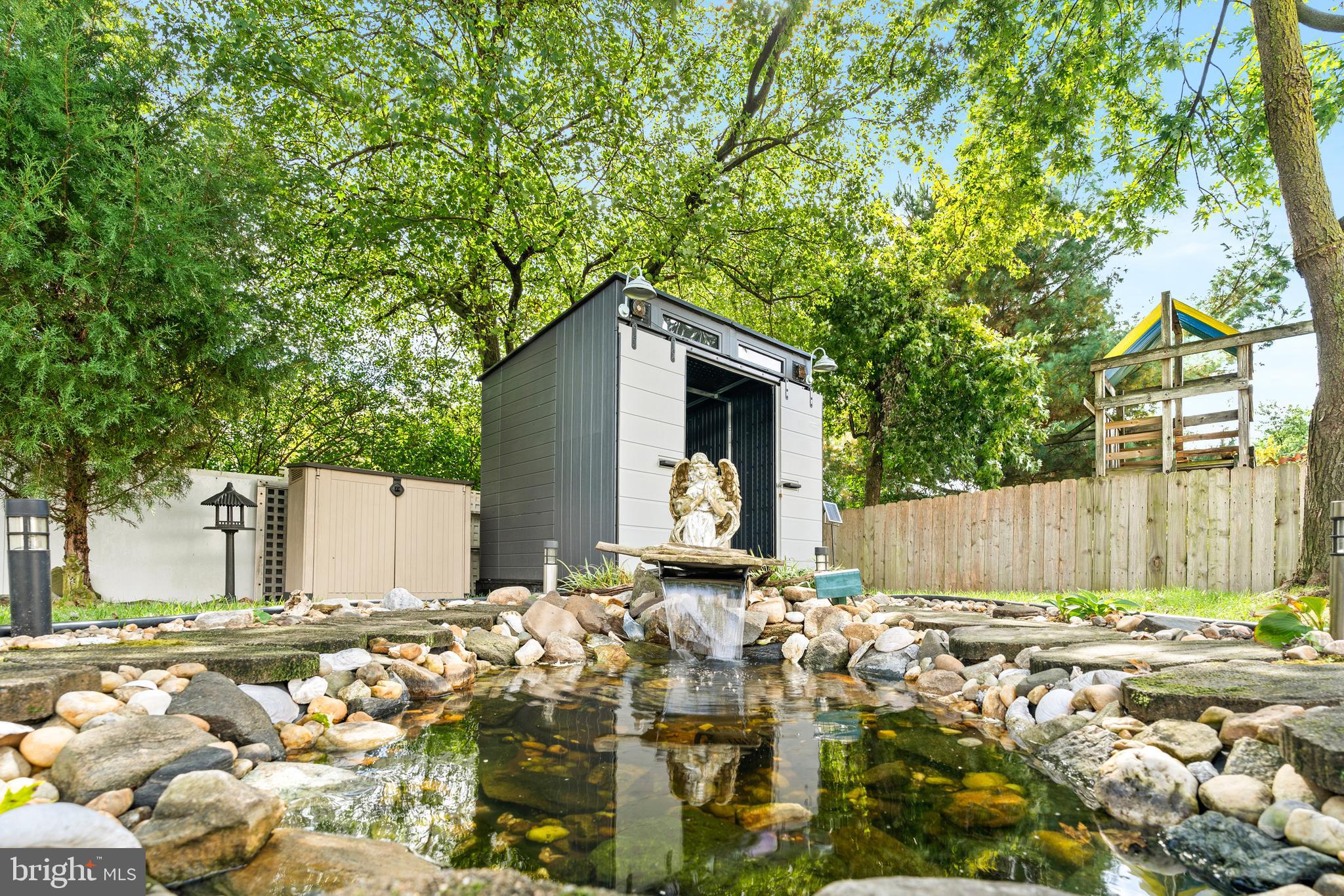 7907 Stone Hearth Road Severn, MD 21144 - Photo 3 of 24 a front view of a house with a yard