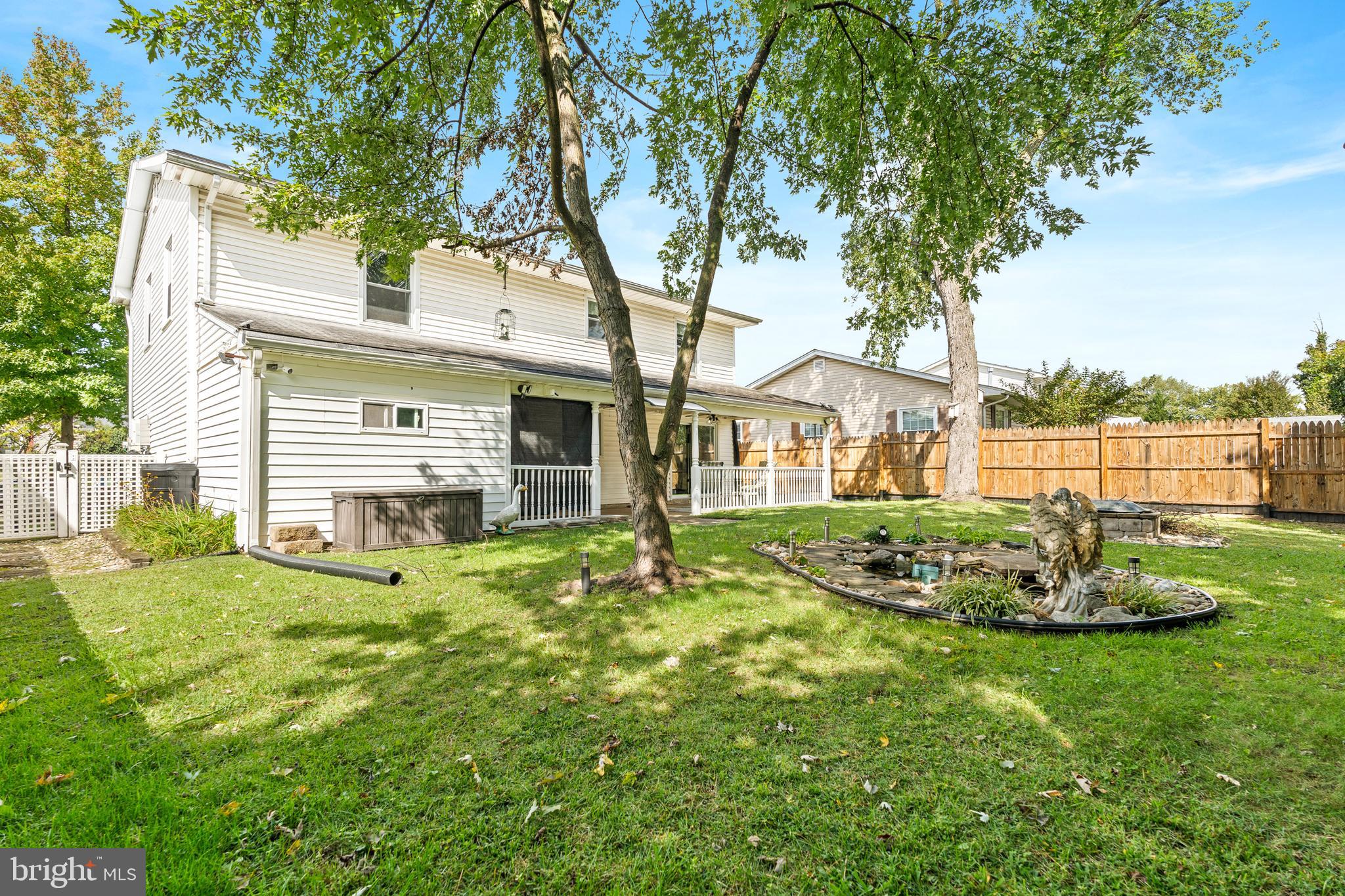 7907 Stone Hearth Road Severn, MD 21144 - Photo 4 of 24 a front view of a house with a yard