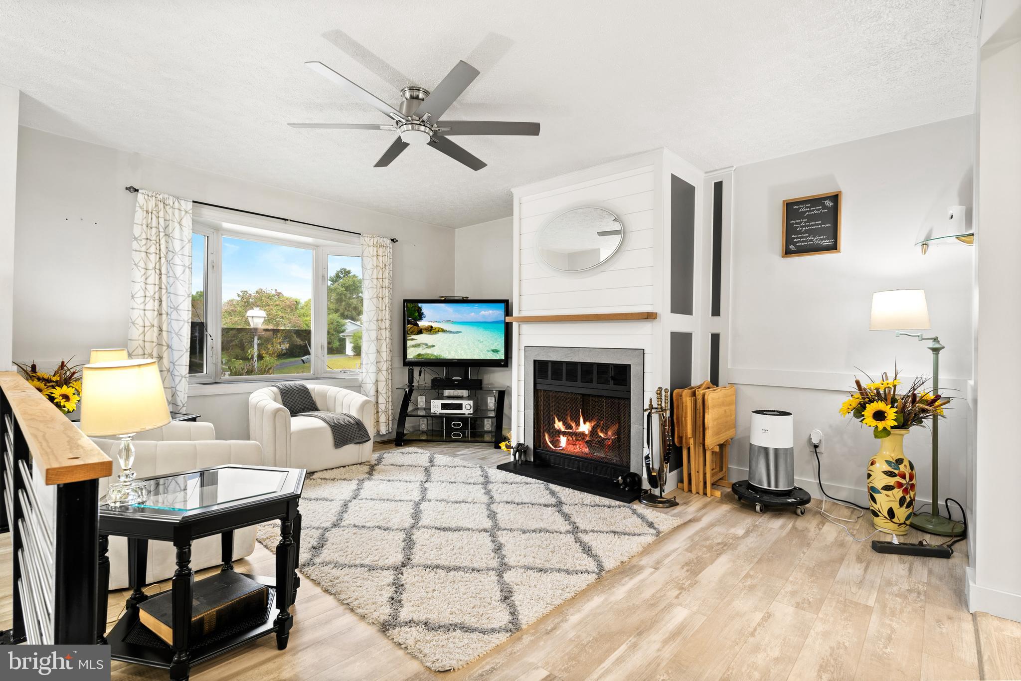 7907 Stone Hearth Road Severn, MD 21144 - Photo 7 of 24 a living room with furniture and a fireplace