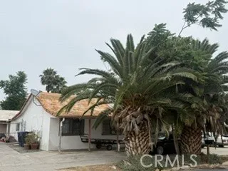 a view of a house with a tree