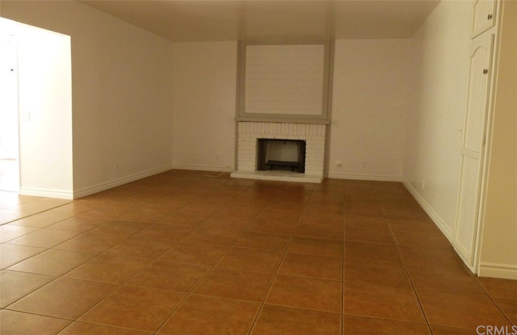 53 Carver Irvine, CA 92620 - Photo 7 of 12 a view of an empty room with a fireplace