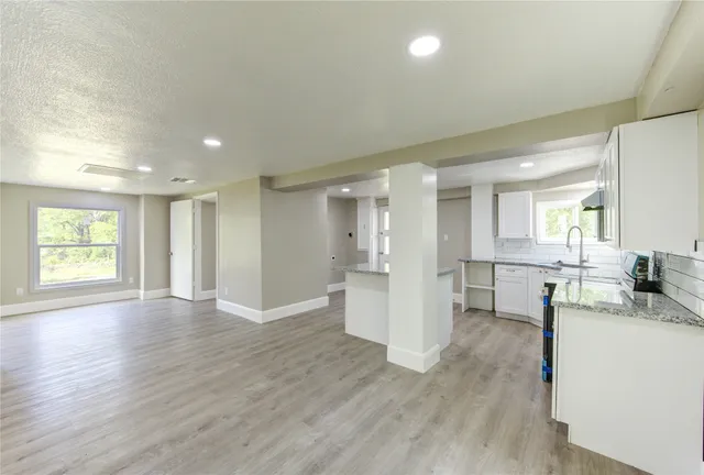 a view of a kitchen and dining room