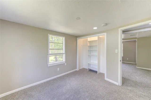 a view of empty room with windows