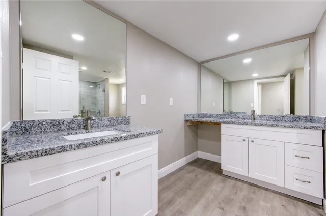 a bathroom with a shower a toilet and a sink