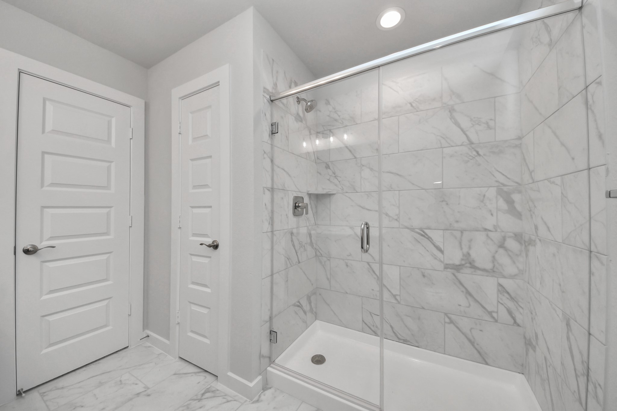 3110 Native Spg Drive Spring, TX 77373 - Photo 31 of 34 Secondary bath features tile flooring, walk-in shower with tile surround, light stained wood cabinets, beautiful light countertop. Sample photo of completed home with similar floor plan. Actual colors and selections may vary.