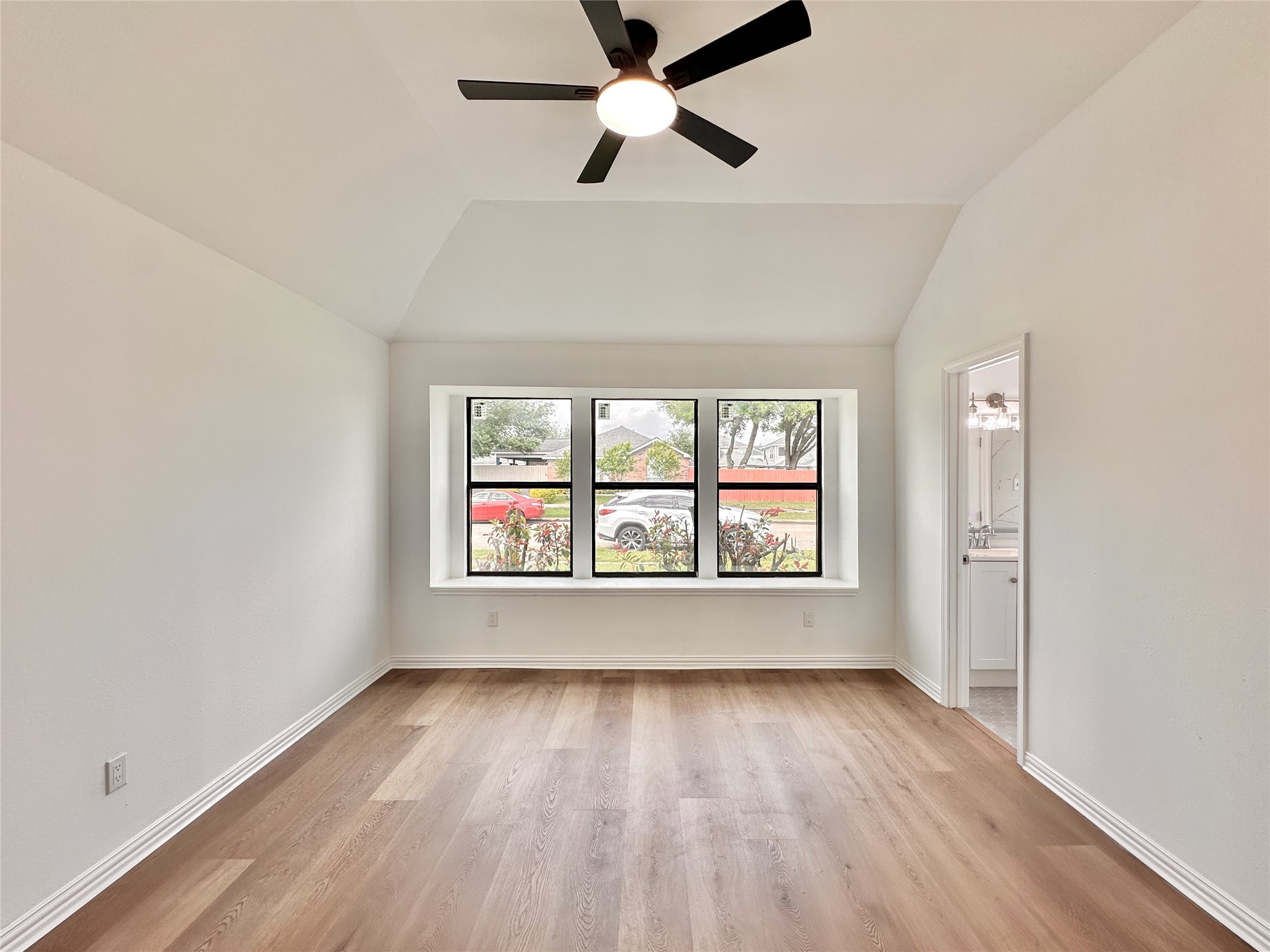16411 Gold Ridge Lane Houston, TX 77053 - Photo 17 of 25 an empty room with wooden floor and windows