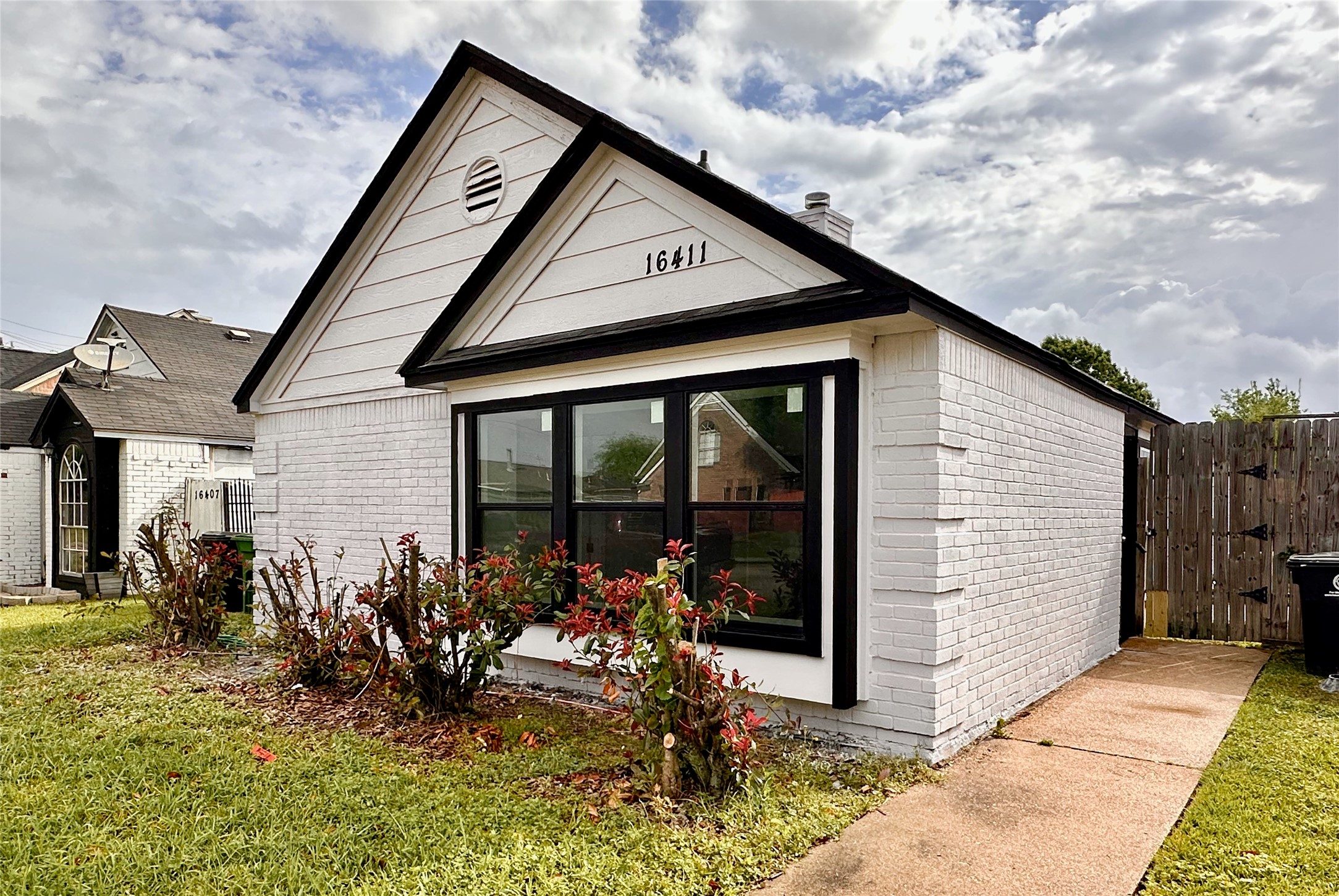 16411 Gold Ridge Lane Houston, TX 77053 - Photo 2 of 25 a front view of a house with basket ball court