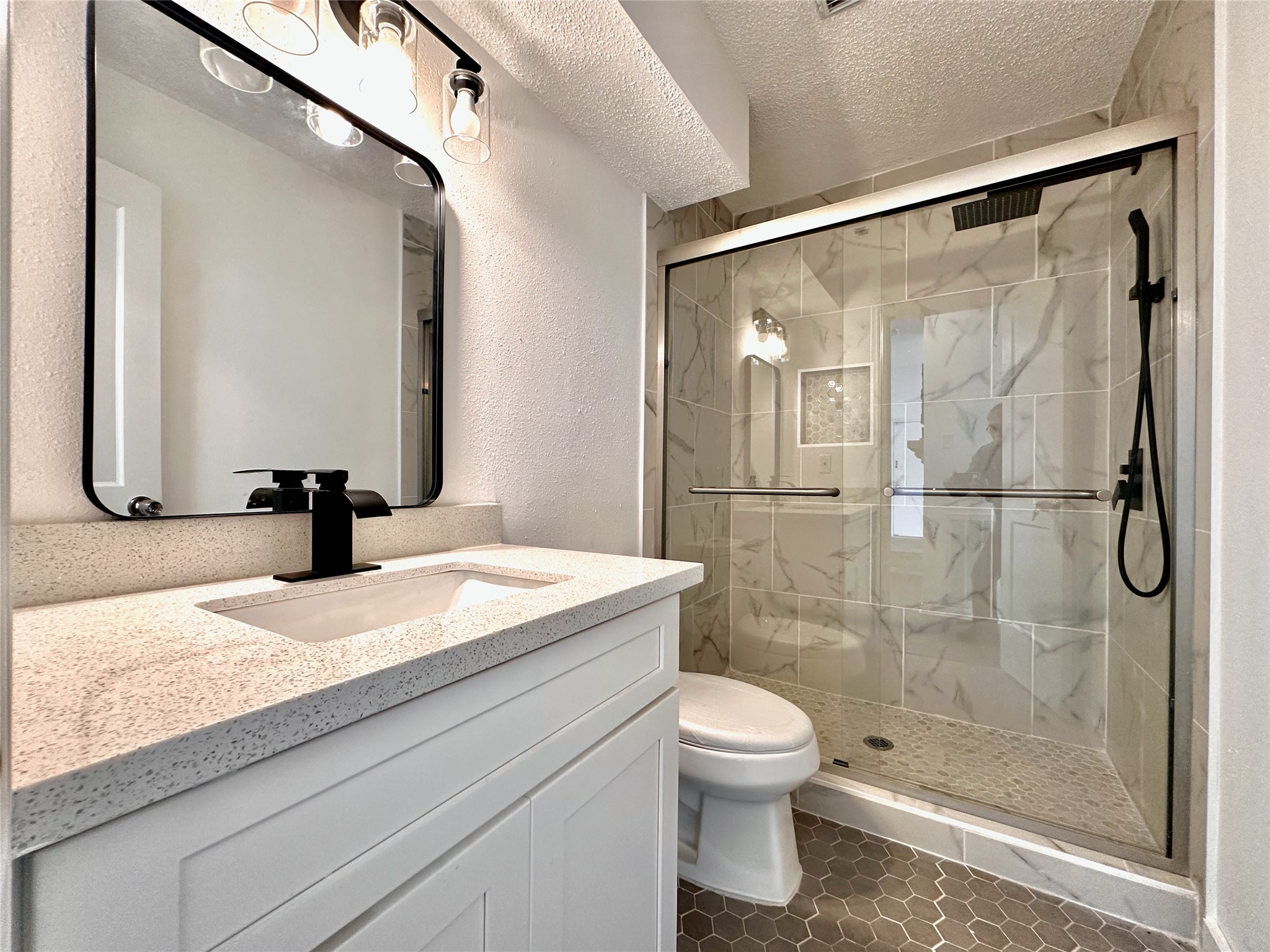 16411 Gold Ridge Lane Houston, TX 77053 - Photo 24 of 25 a bathroom with a granite countertop sink toilet and shower