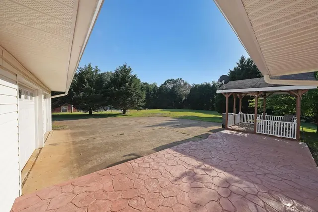 a view of backyard with green space