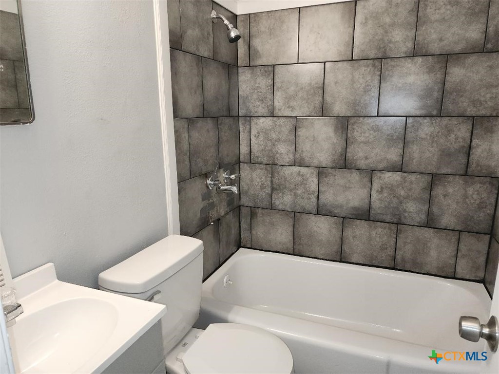 1309 South 3rd Street, Unit B Temple, TX 76504 - Photo 6 of 6 a bathroom with a toilet and bathtub
