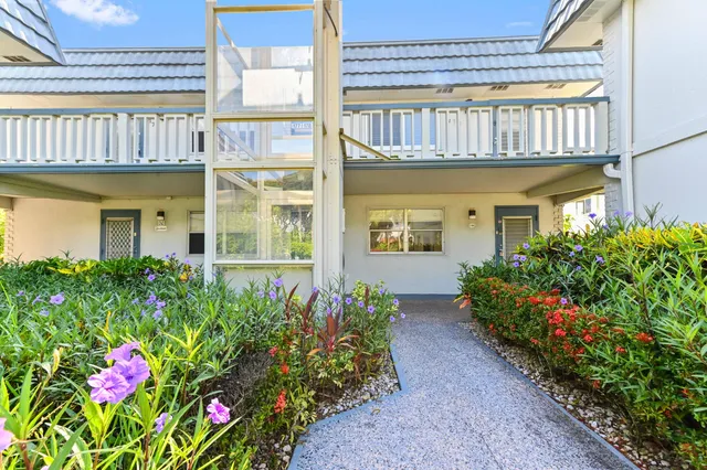 a flower garden is sitting in front of a building