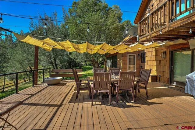 a spacious bedroom with a bed and wooden floor