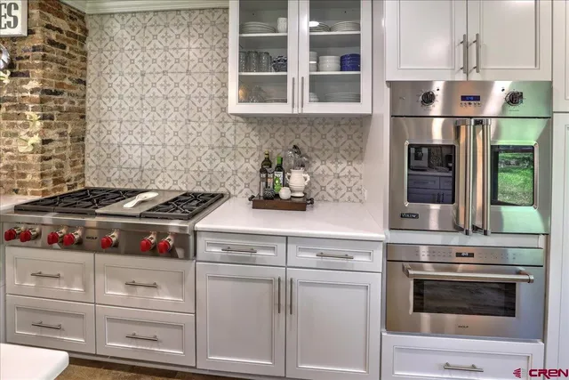 a kitchen with a stove and a sink