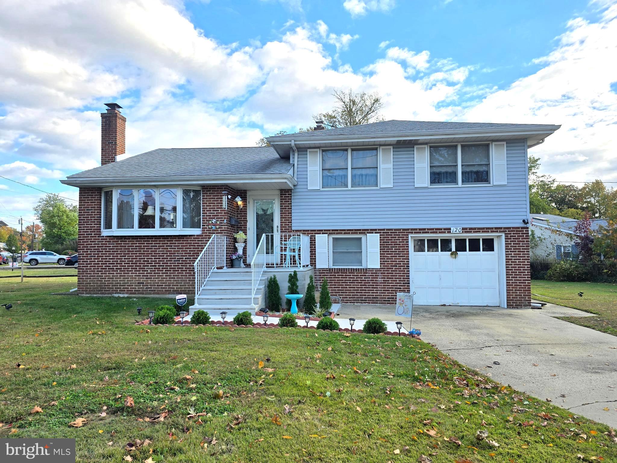 120 East Center Avenue Maple Shade, NJ 08052 - Photo 1 of 34 a front view of a house with a yard and garage