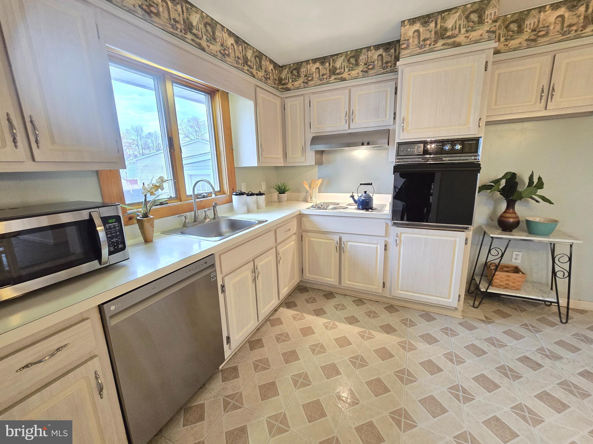 120 East Center Avenue Maple Shade, NJ 08052 - Photo 11 of 34 a kitchen with a sink a stove a microwave and cabinets