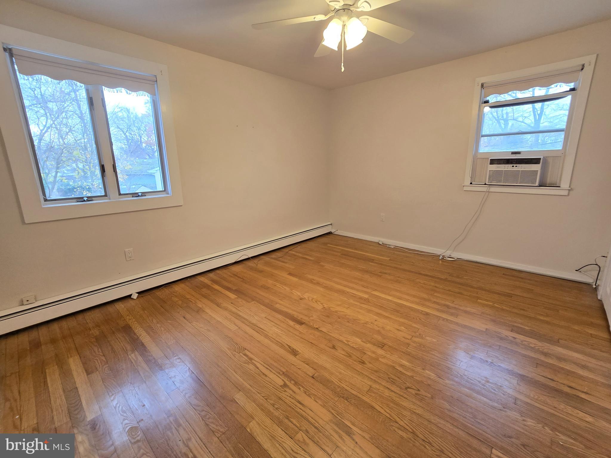 120 East Center Avenue Maple Shade, NJ 08052 - Photo 21 of 34 a view of an empty room with wooden floor and a window