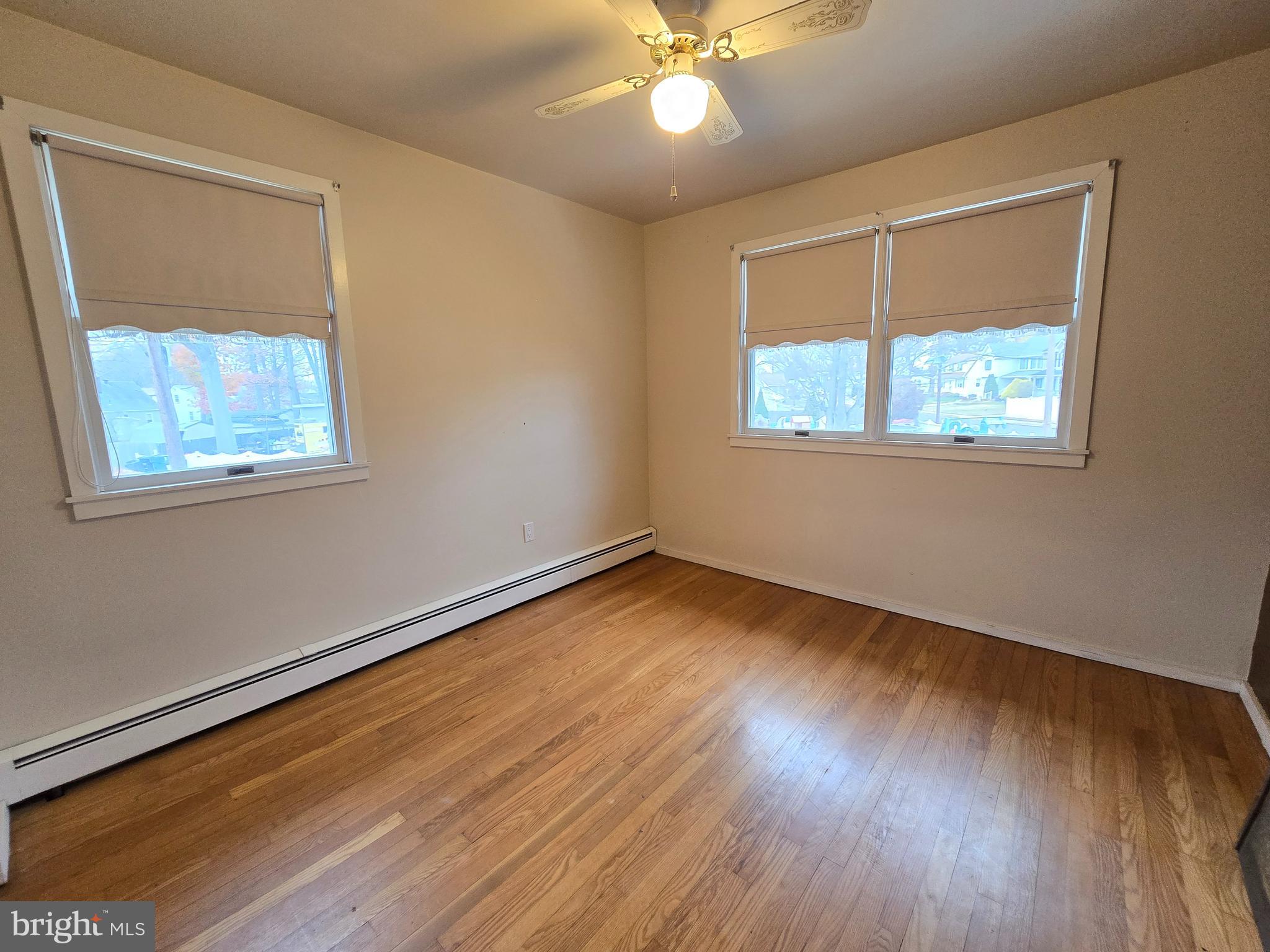 120 East Center Avenue Maple Shade, NJ 08052 - Photo 23 of 34 a view of an empty room with wooden floor and a window