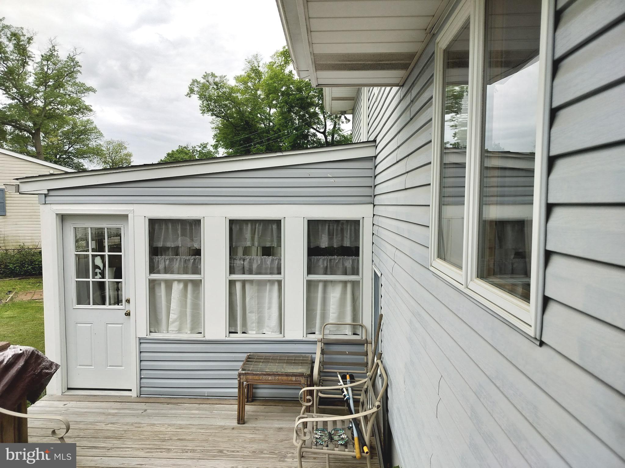 120 East Center Avenue Maple Shade, NJ 08052 - Photo 29 of 34 a view of house with a bench and floor to ceiling windows