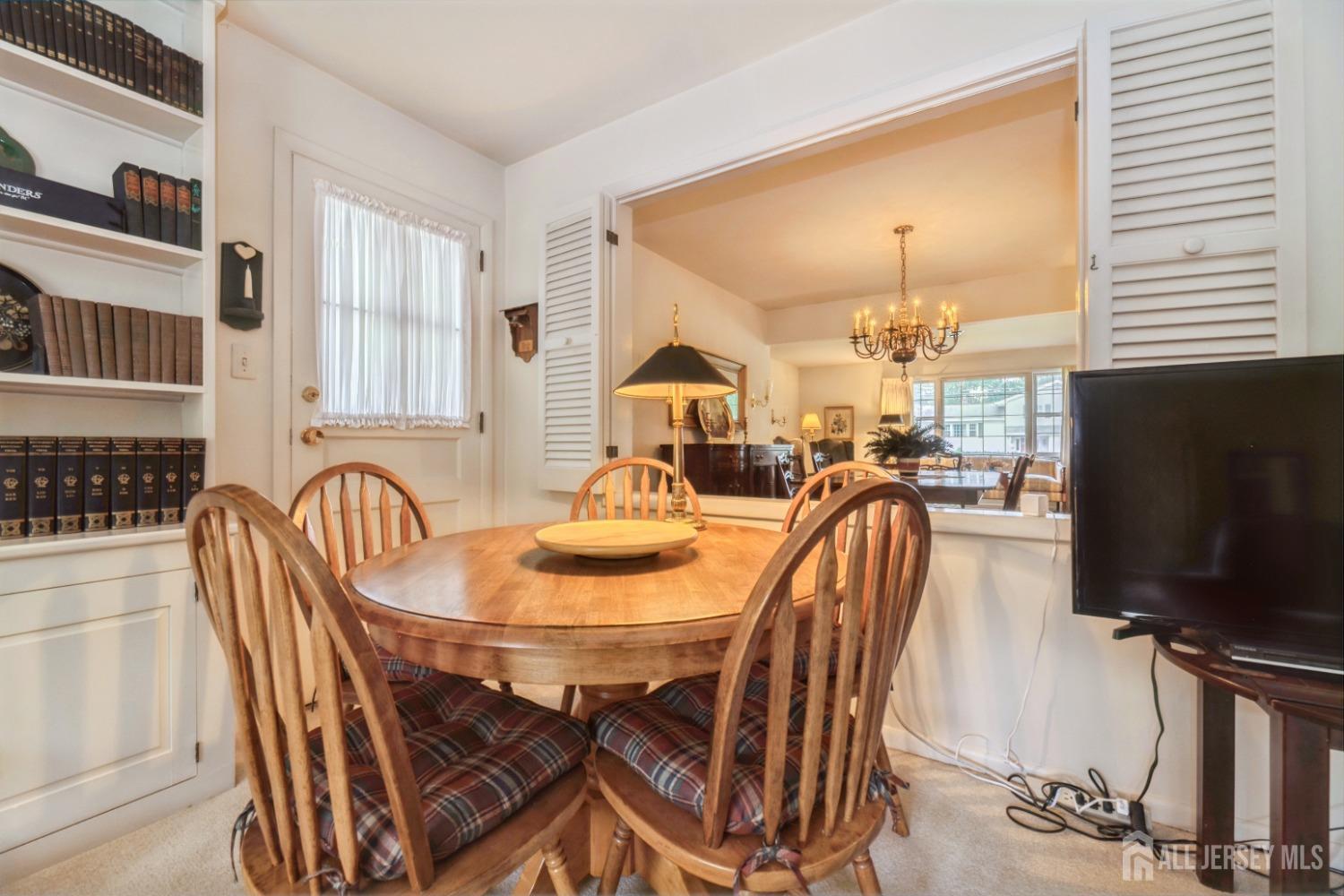 295 Dallas Road North Brunswick, NJ 08902 - Photo 16 of 40 a dining room with furniture and wooden floor