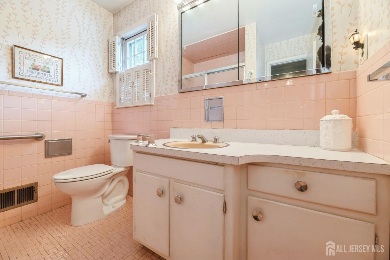295 Dallas Road North Brunswick, NJ 08902 - Photo 23 of 40 a bathroom with a sink toilet and vanity