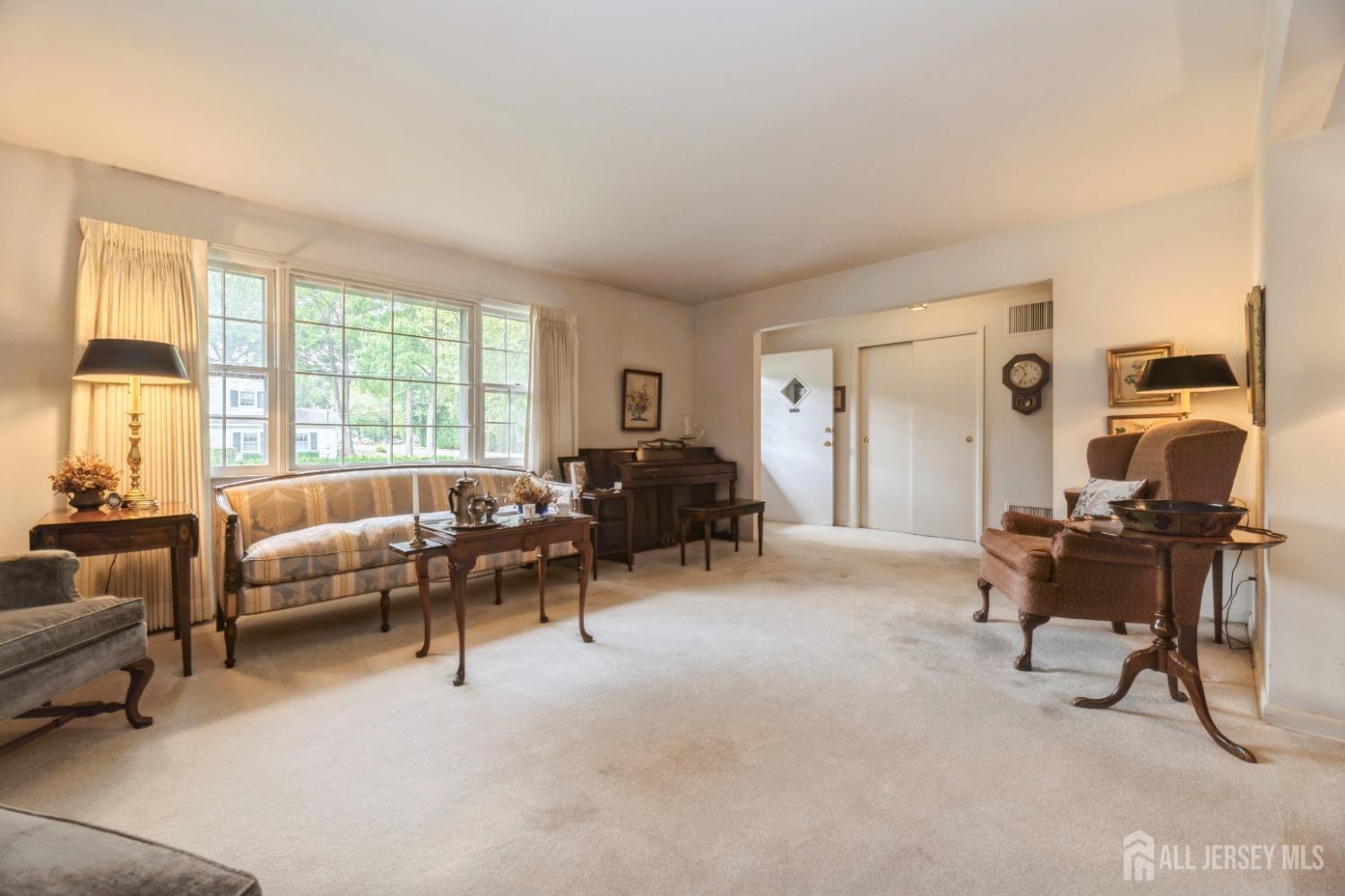 295 Dallas Road North Brunswick, NJ 08902 - Photo 3 of 40 a living room with furniture and a large window