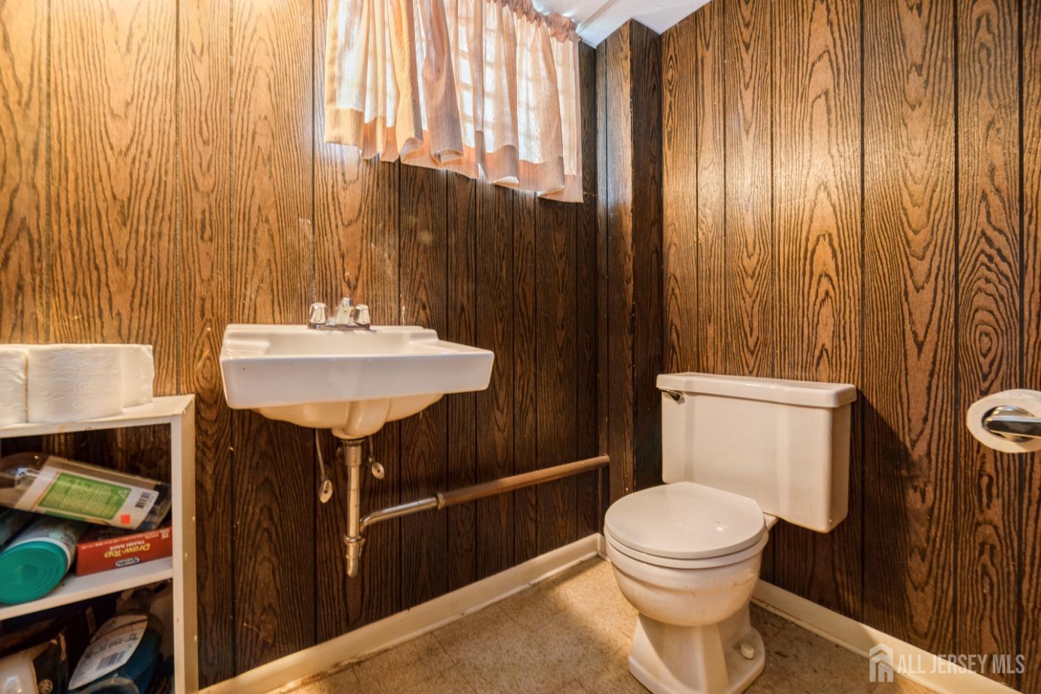 295 Dallas Road North Brunswick, NJ 08902 - Photo 31 of 40 a bathroom with a sink a toilet and shower curtain