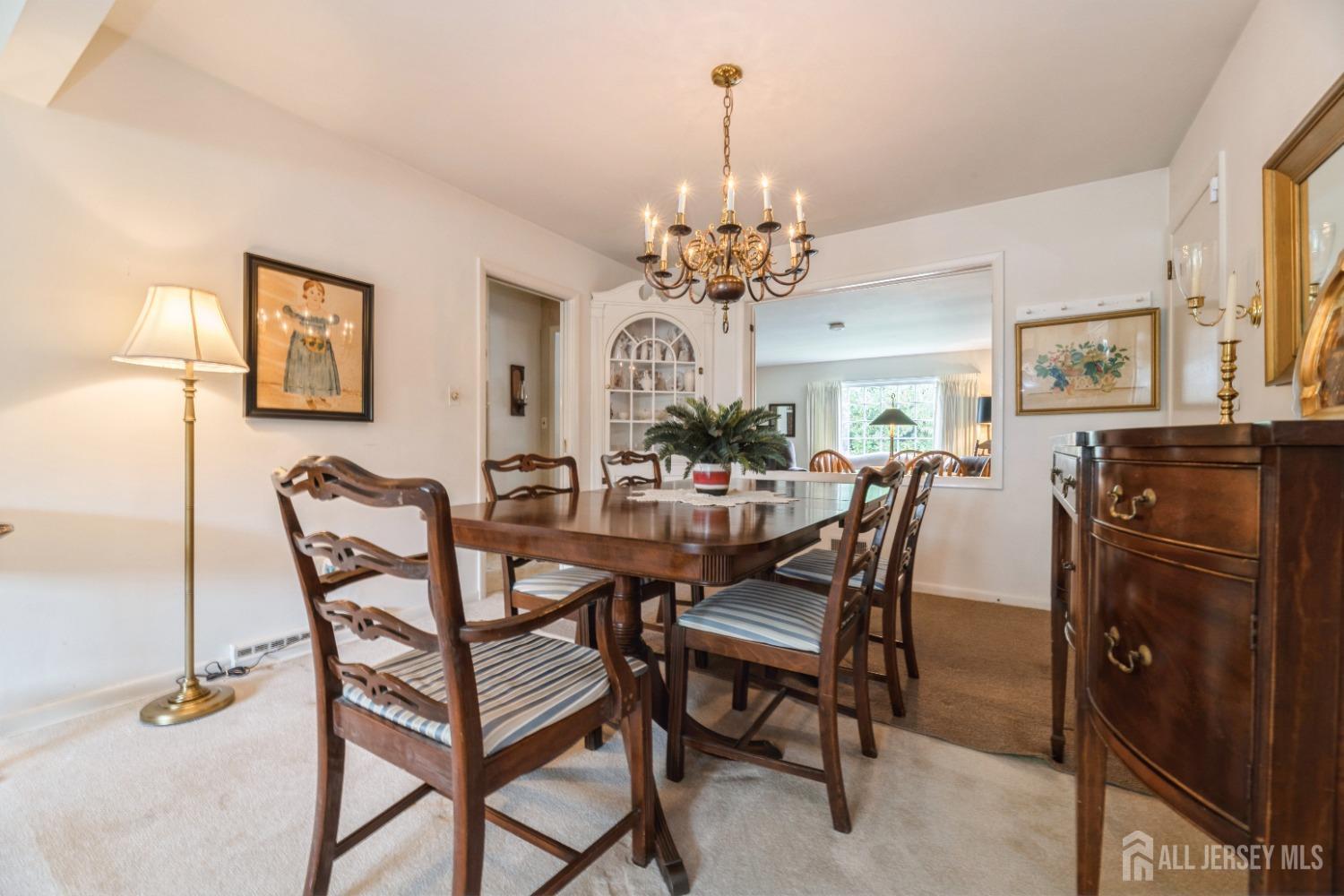295 Dallas Road North Brunswick, NJ 08902 - Photo 7 of 40 a view of a dining room with furniture and chandelier