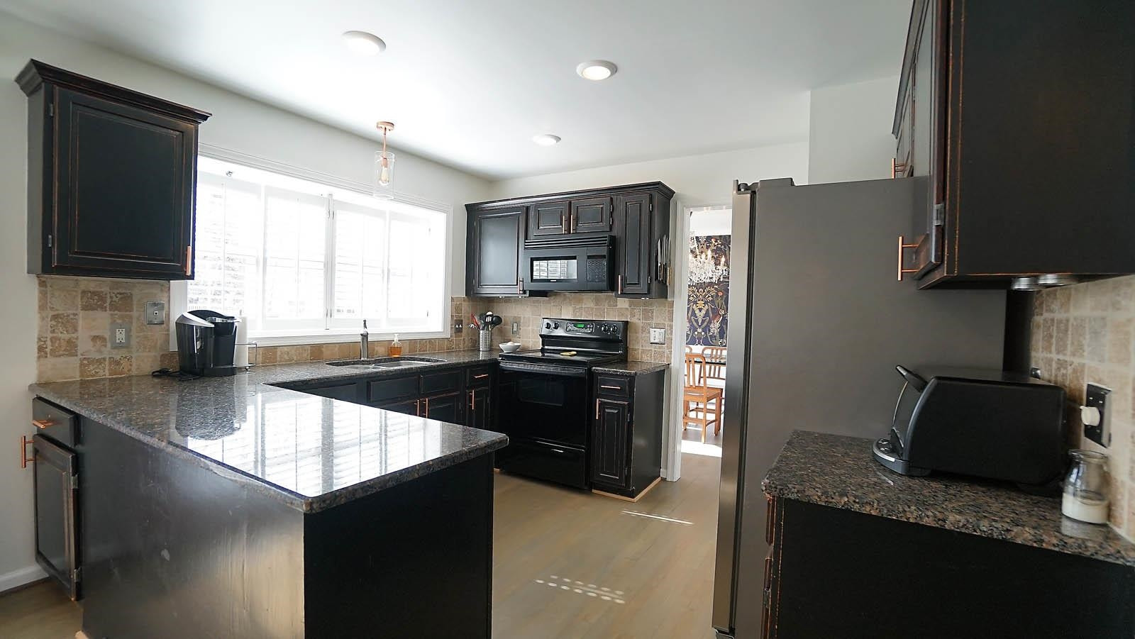 8300 Grey Abbey Place Raleigh, NC 27615 - Photo 2 of 34 Remodeled with granite counters, tile backsplash Kitchen