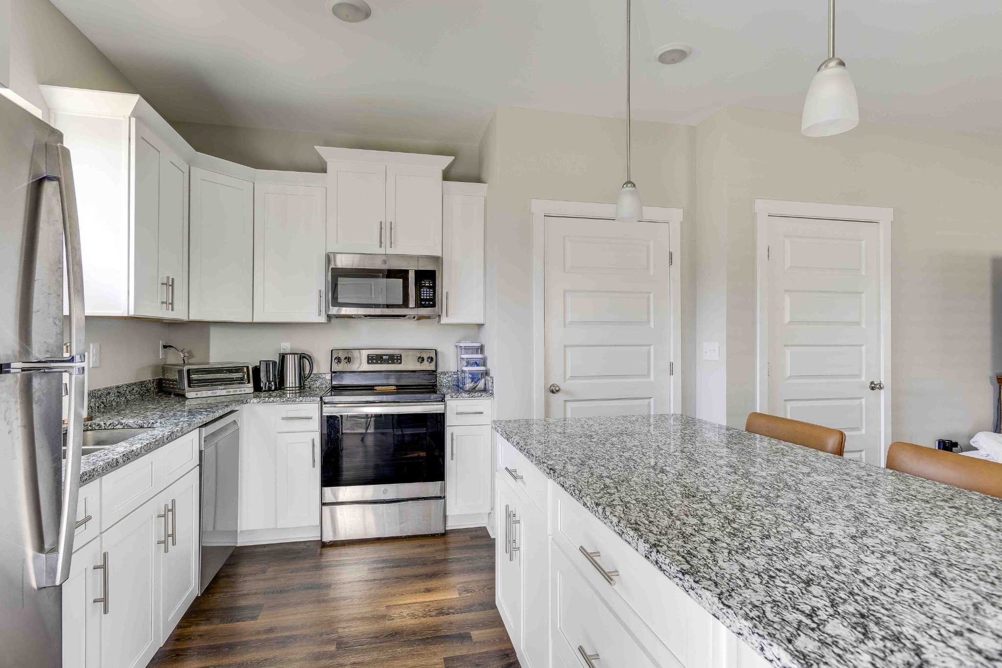 1061 Wells Way Spring Hill, TN 37174 - Photo 11 of 21 a kitchen with stainless steel appliances granite countertop a stove and a sink