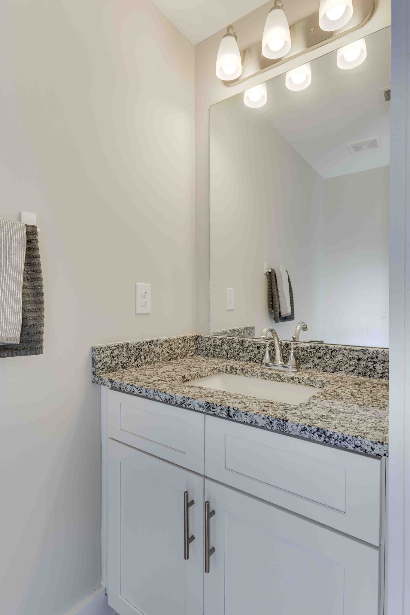 1061 Wells Way Spring Hill, TN 37174 - Photo 12 of 21 a bathroom with a granite countertop sink and a mirror