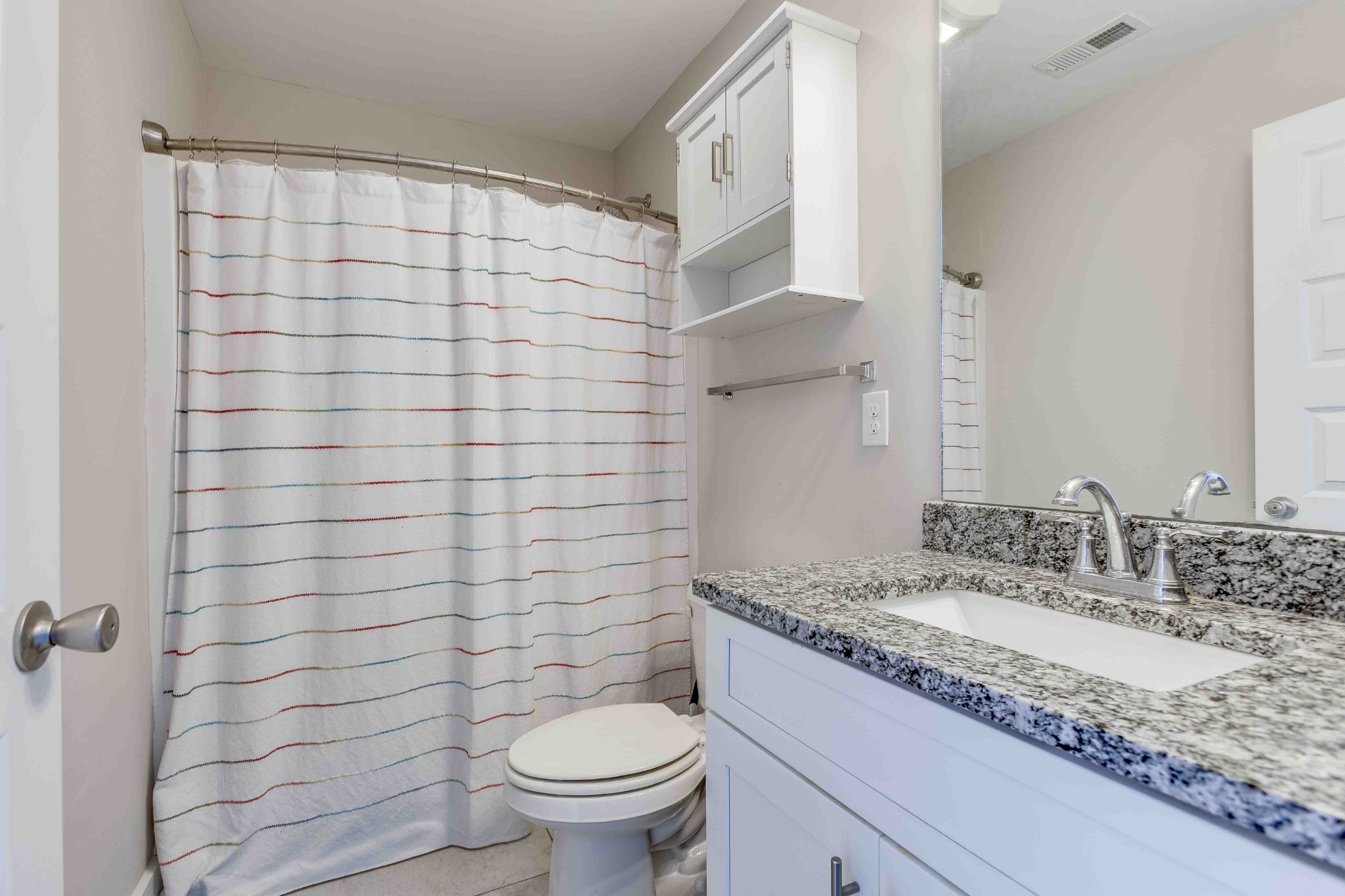 1061 Wells Way Spring Hill, TN 37174 - Photo 19 of 21 a bathroom with a granite countertop sink a toilet and shower