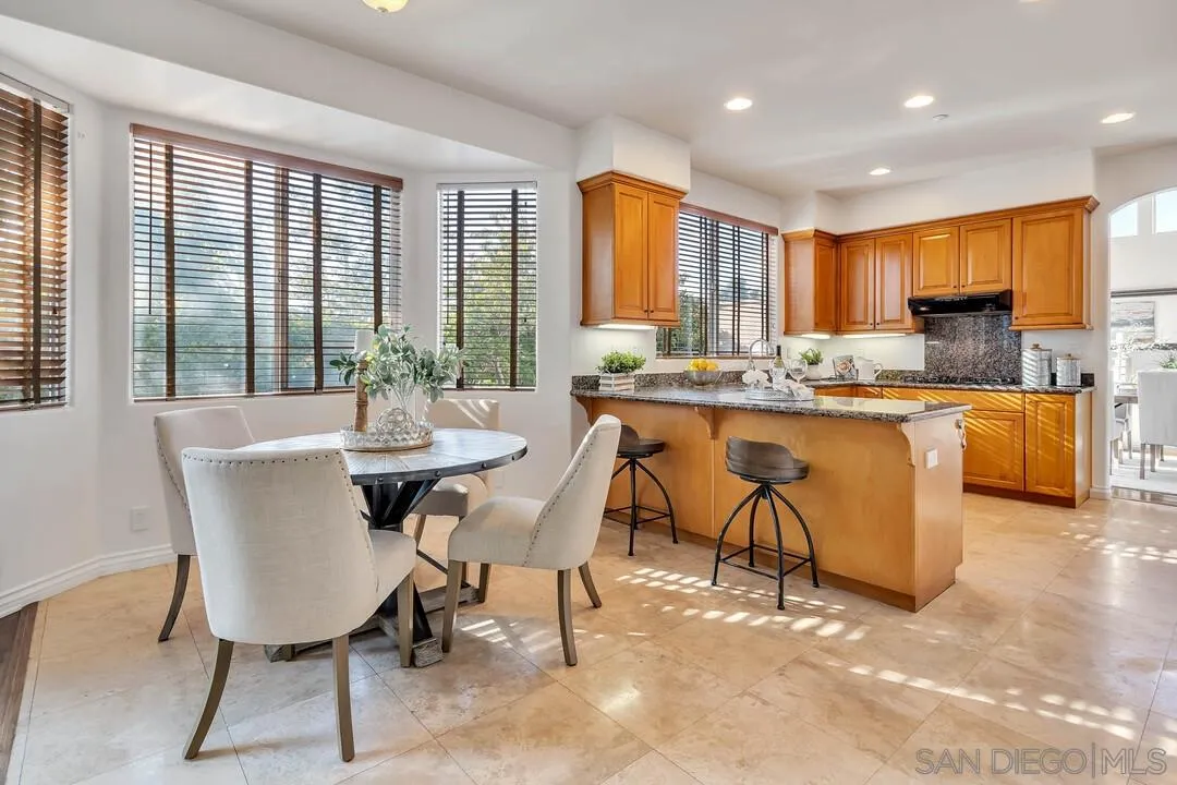 1731 Olivenhain Road Encinitas, CA 92024 - Photo 12 of 31 a view of a dining room with furniture window and outside view