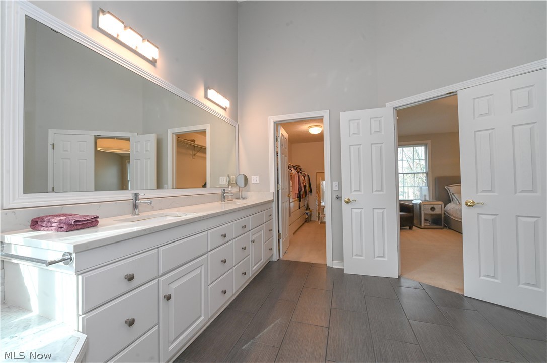 1688 Sheridan Road South Euclid, OH 44121 - Photo 23 of 48 Bathroom featuring oversized vanity, a high ceiling, and tile floors