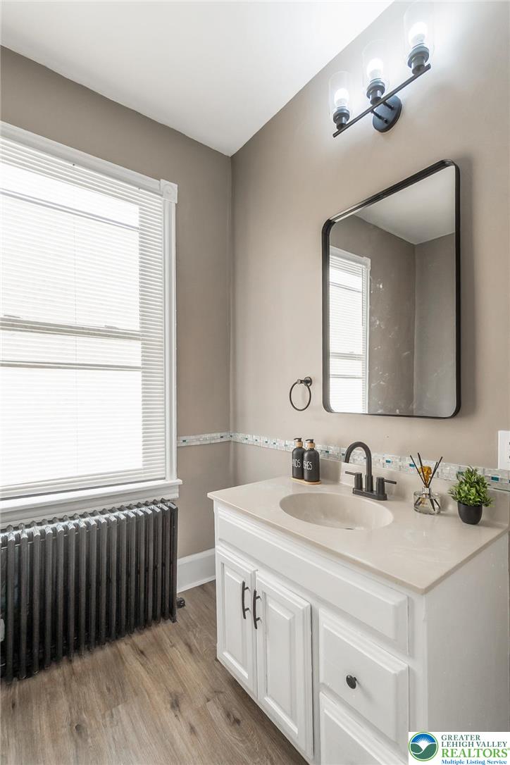 2213 Village Road Orefield, PA 18069 - Photo 14 of 41 a bathroom with a double vanity sink and a mirror