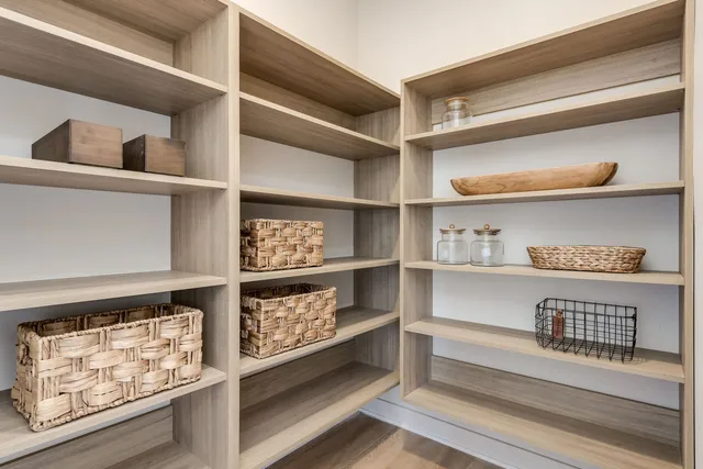 a bedroom with a bed and a lamp