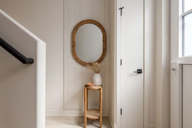 a porch with a table and chairs