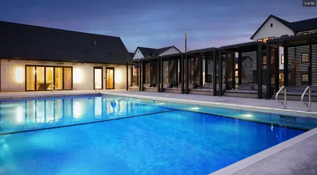 a lobby with furniture and a potted plant