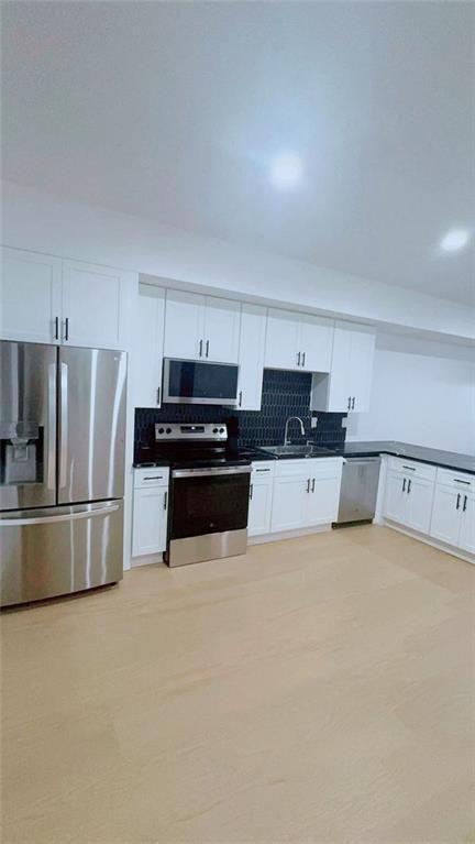 Undisclosed Address Brookhaven, GA 30319 - Photo 13 of 29 a kitchen with stainless steel appliances a refrigerator sink and white cabinets