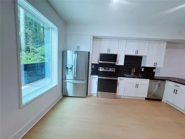 a kitchen with granite countertop a counter space and a sink