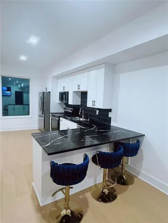 a bedroom with a bed and wall painting