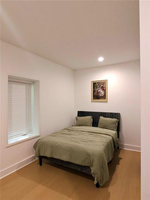 Undisclosed Address Brookhaven, GA 30319 - Photo 22 of 29 a bedroom with a bed and a window