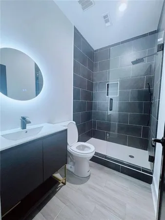 a bathroom with a toilet and a sink