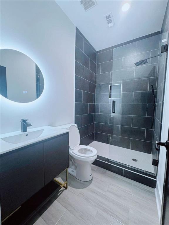 Undisclosed Address Brookhaven, GA 30319 - Photo 24 of 29 a bathroom with a sink a toilet and shower