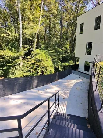 a view of a chairs and table in the patio