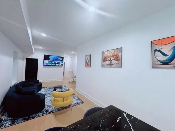 a living room with furniture and a rug