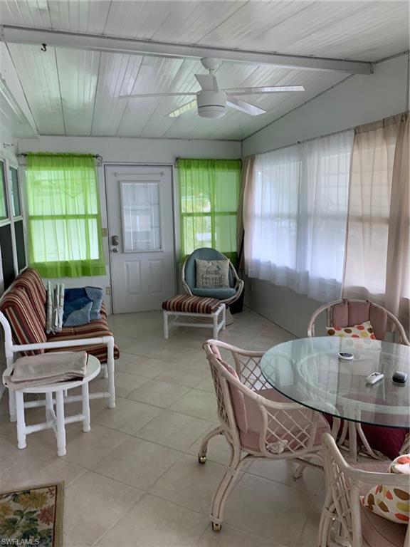 9322 Pitt Road Bonita Springs, FL 34135 - Photo 11 of 24 a kitchen with furniture and window