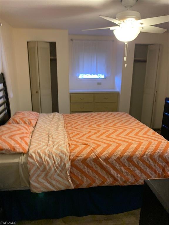 9322 Pitt Road Bonita Springs, FL 34135 - Photo 14 of 24 a bedroom with a bed and a mirror