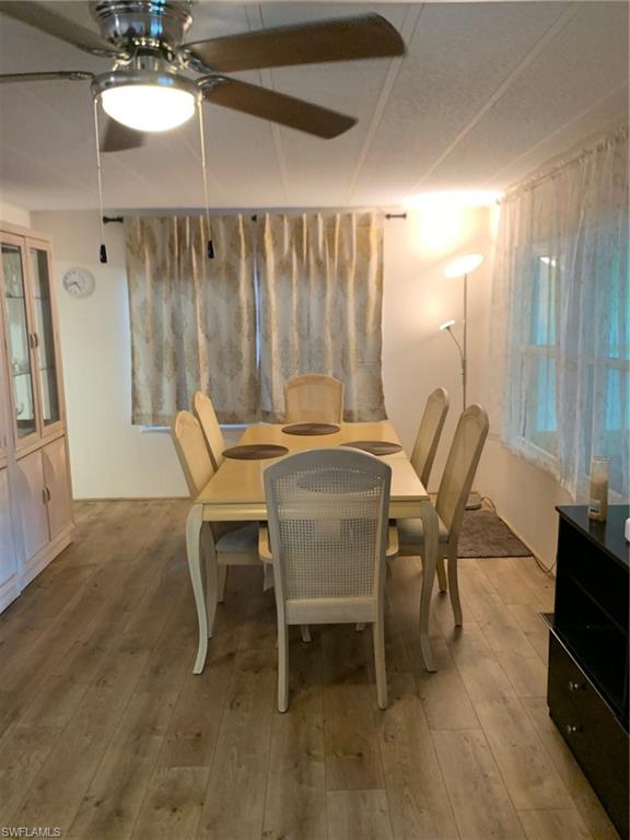 9322 Pitt Road Bonita Springs, FL 34135 - Photo 22 of 24 a work room with furniture and a chandelier